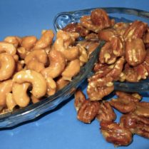 Buttery glazed cashews and pecans in a dish