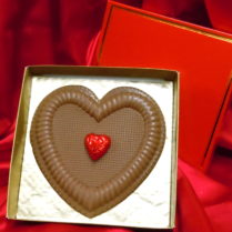 Beautiful solid milk chocolate heart in gold foiled gift box