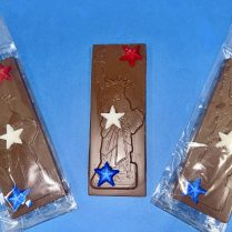 premium milk chocolate bar features Lady Liberty with red, white and blue stars