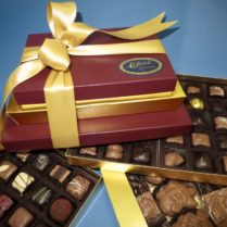 crimson and gold gift tower of gourmet chocolates