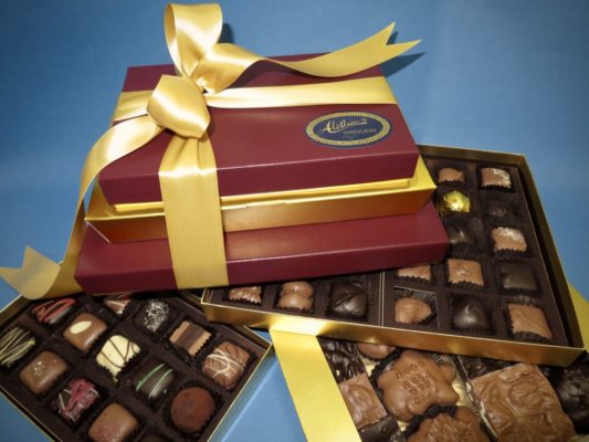crimson and gold gift tower of gourmet chocolates