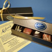 bronze tone box of gourmet chocolate truffles