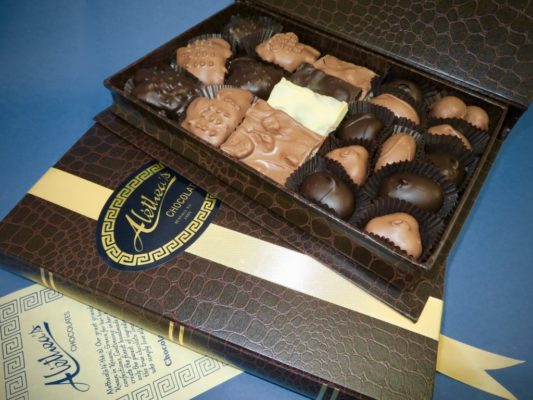 handsome book box filled with gourmet chocolates