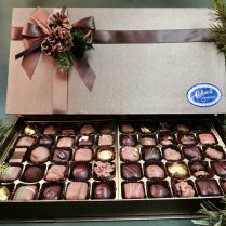 Handsome journal style Holiday box filled with gourmet chocolate confections