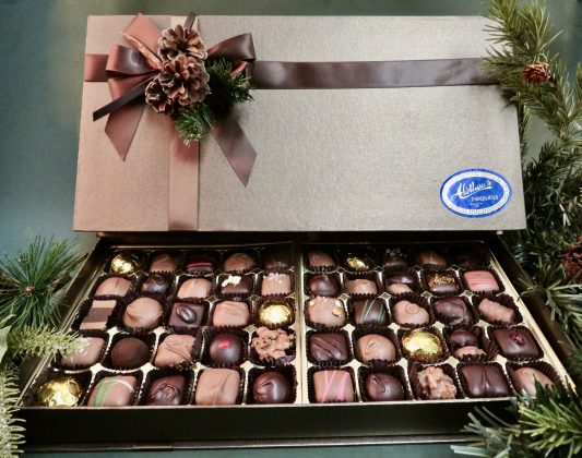 Handsome journal style Holiday box filled with gourmet chocolate confections