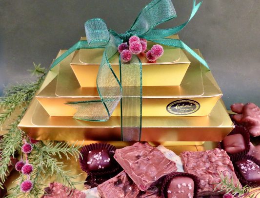 Beautiful gold Holiday tower filled with artisan chocolates