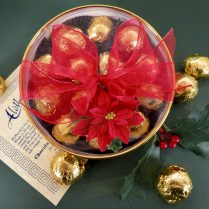 Round gold Holiday gift box filled with premium cherry cordials