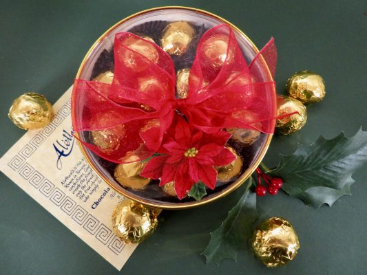 Round gold Holiday gift box filled with premium cherry cordials