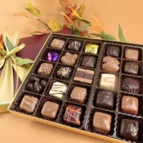 Impressive box of Assorted Artisan chocolates in a fall decorated box.