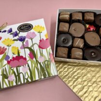 Pretty floral box filled with gourmet Peanut butter chocolate confections