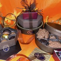 charming mini tower with fall decor and filled with artisan chocolates